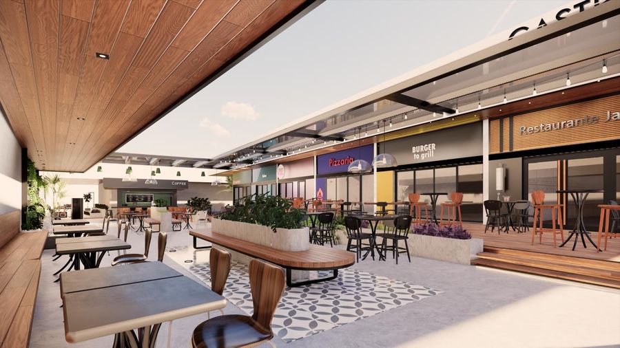 Praça de alimentação do ASA Open Mall, com mesas sob o forro de madeira e as lojas de gastronomia ao fundo